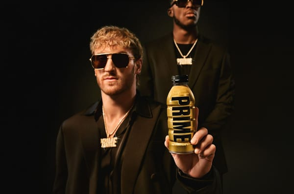 Youtube Logan Paul holding a PRIME bottle & KSI in the back.